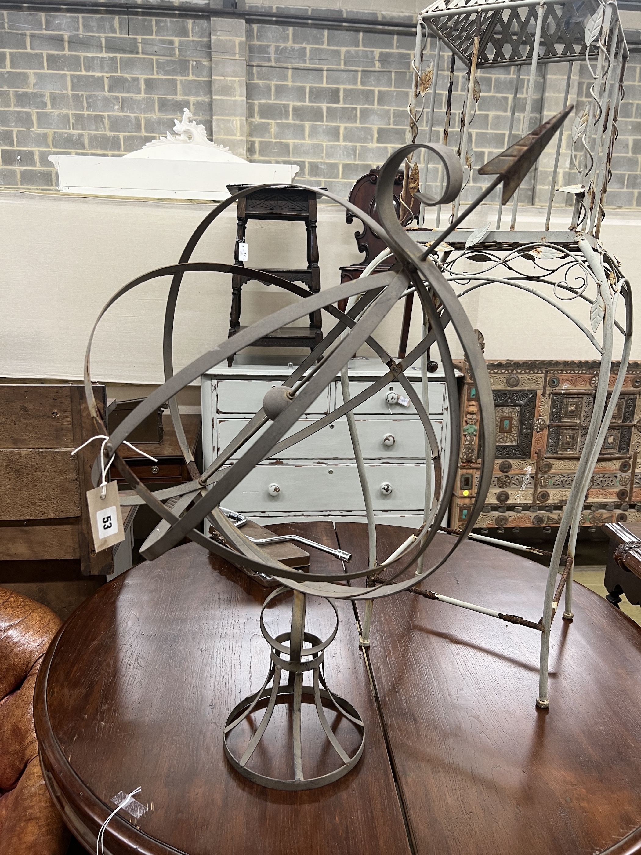 A painted metal armillary sphere, height 84cm together with a lantern